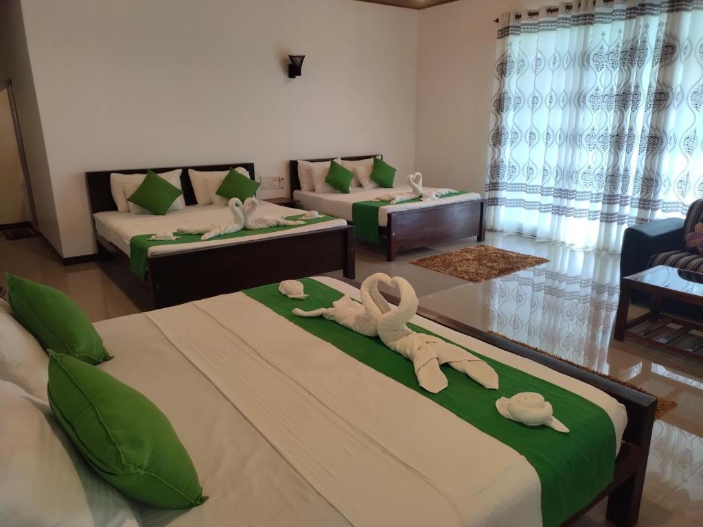 Postel nebo postele na pokoji v ubytování Village Mango Resort Yala