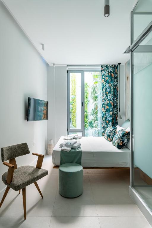 Letto o letti in una camera di Ciel Suites Athens