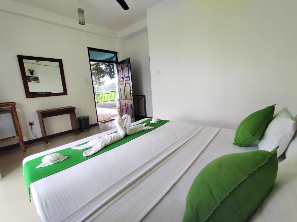 Postel nebo postele na pokoji v ubytování Village Mango Resort Yala