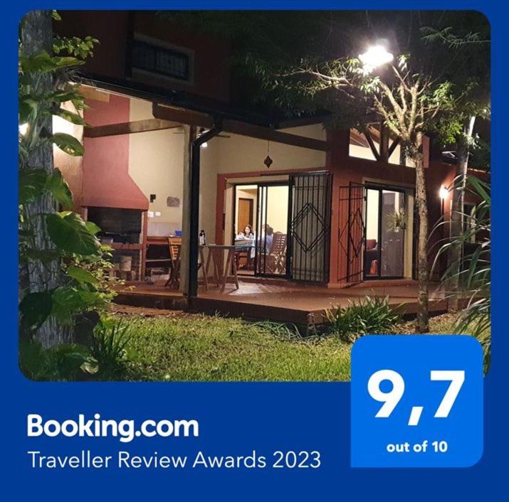 a house with a sign that says travel review awards at Ventana a la Selva Casa Residencial in Eldorado
