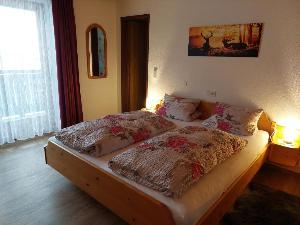 Postel nebo postele na pokoji v ubytování Pension Wildental