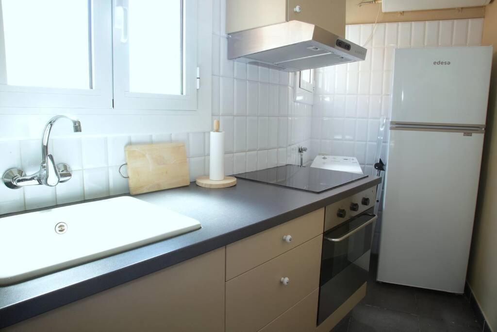 Kuchyň nebo kuchyňský kout v ubytování Mirador de Sant Llorenç · Acogedor apartamento 6p