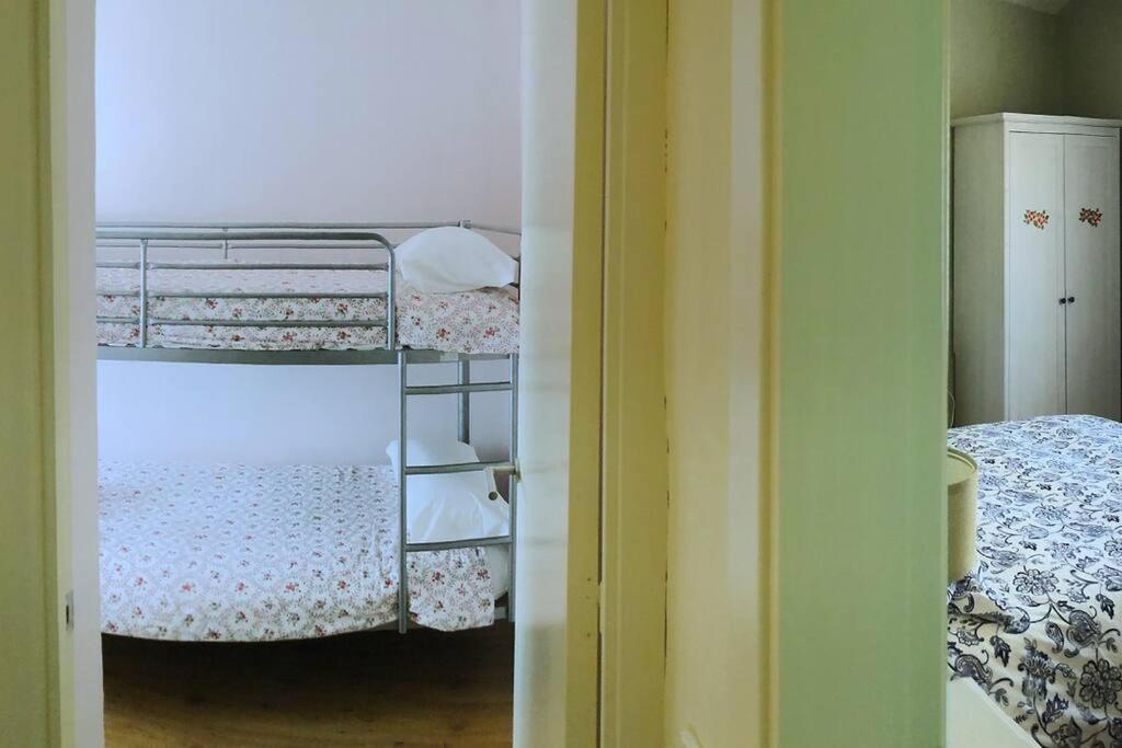 Postel nebo postele na pokoji v ubytování Mirador de Sant Llorenç · Acogedor apartamento 6p