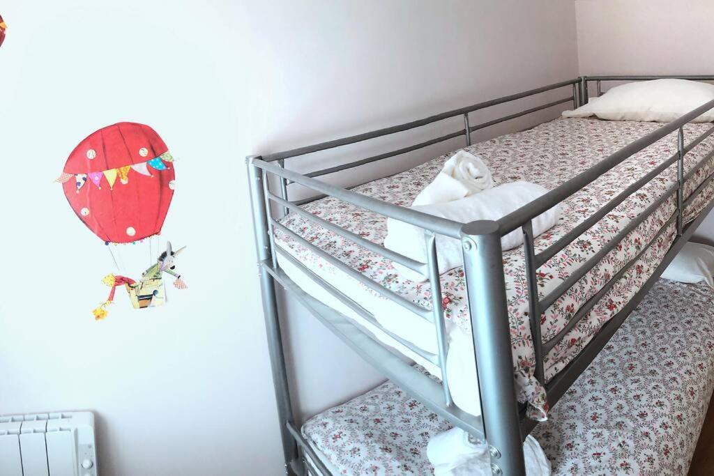 Postel nebo postele na pokoji v ubytování Mirador de Sant Llorenç · Acogedor apartamento 6p