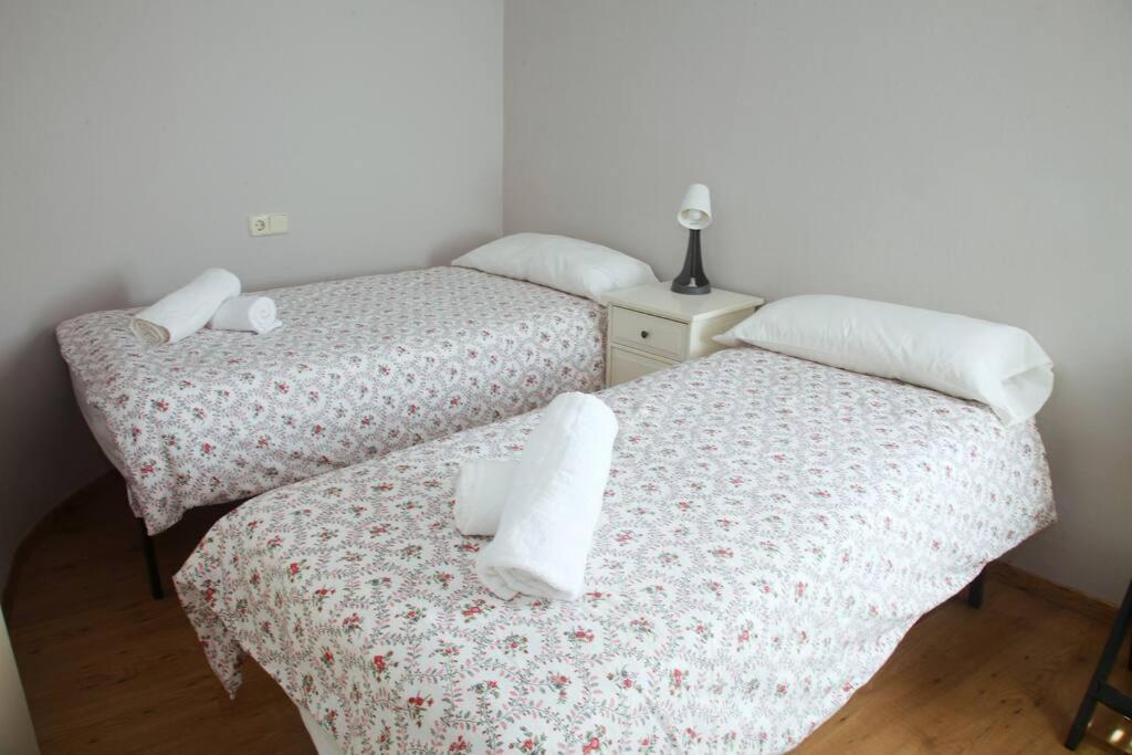Postel nebo postele na pokoji v ubytování Mirador de Sant Llorenç · Acogedor apartamento 6p