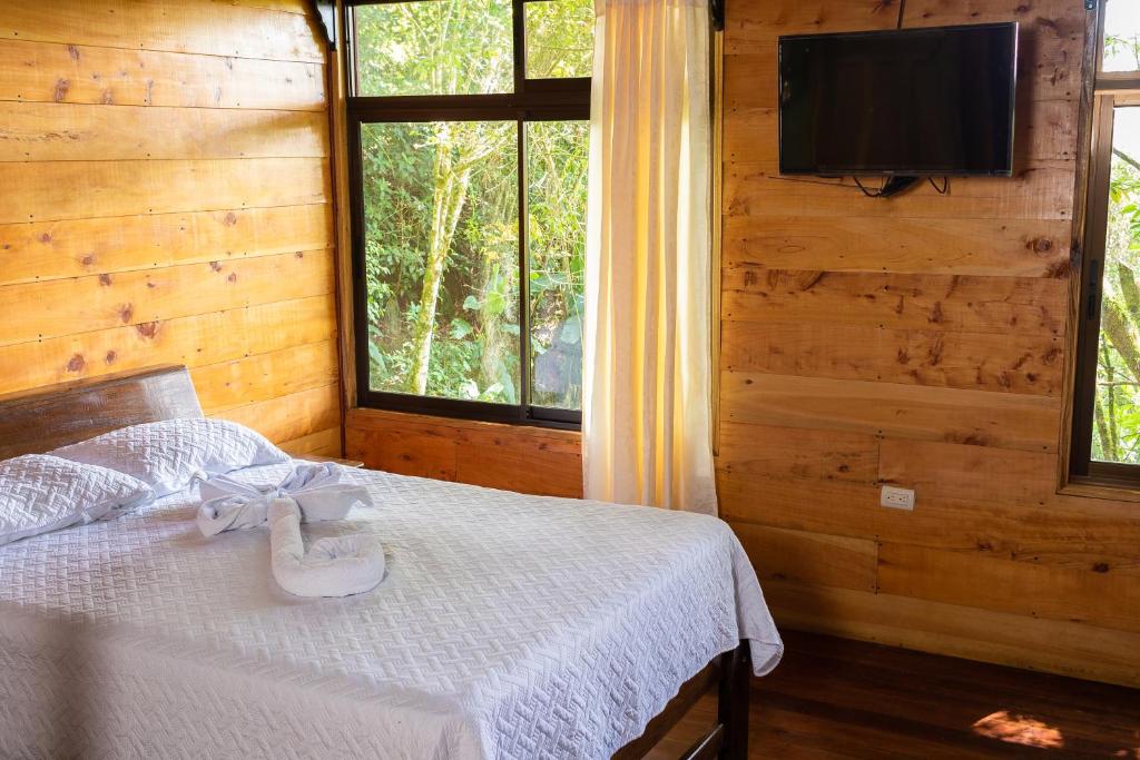 Postel nebo postele na pokoji v ubytování Cabañas el Bosque