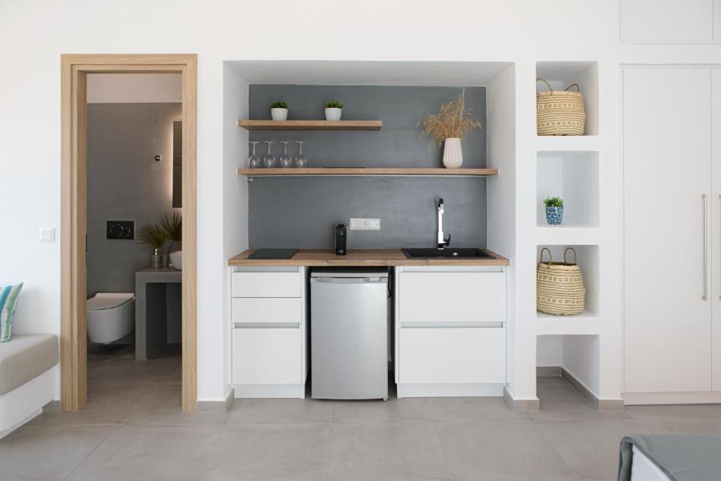 Kuchyň nebo kuchyňský kout v ubytování Seanfinity Beachfront Suites