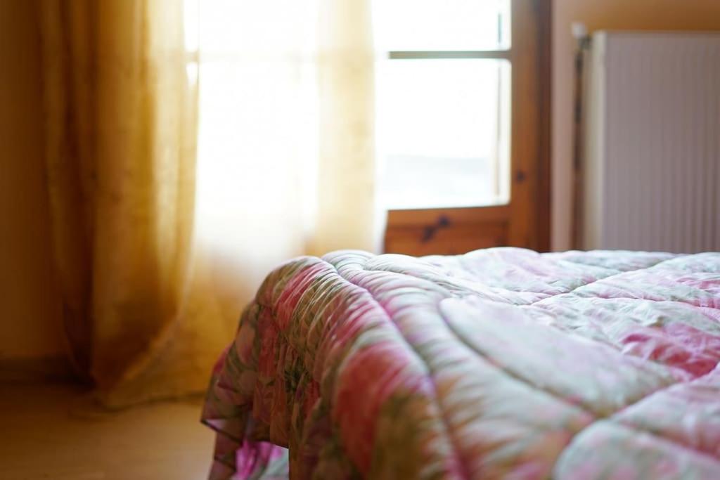 A bed or beds in a room at Traditional cozy residence in Lafkos, Pelion