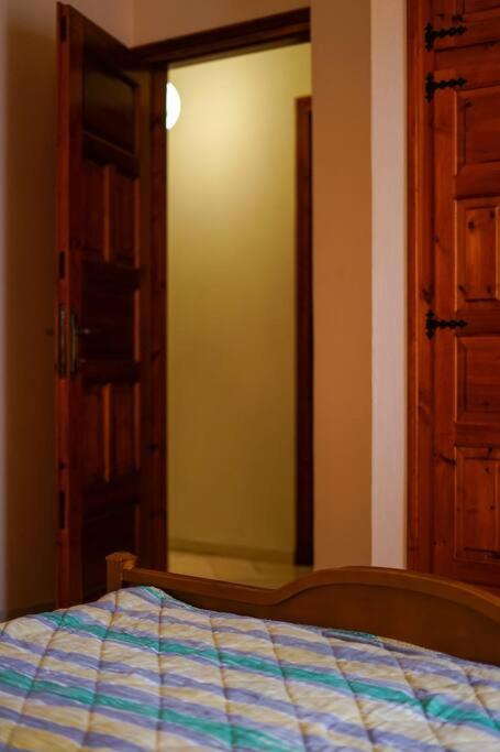 A bed or beds in a room at Traditional cozy residence in Lafkos, Pelion