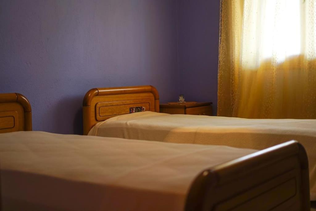 A bed or beds in a room at Traditional cozy residence in Lafkos, Pelion