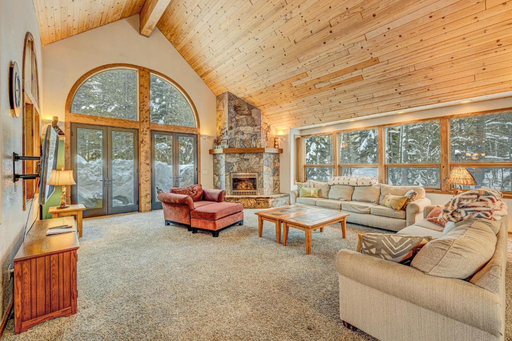 a living room with couches and a fireplace at Donner Lake House in Truckee