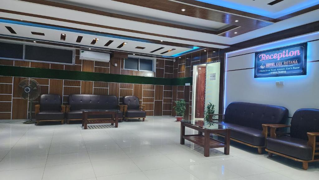a waiting room with chairs and a sign on a wall at Hotel Cox Rotana in Cox's Bazar