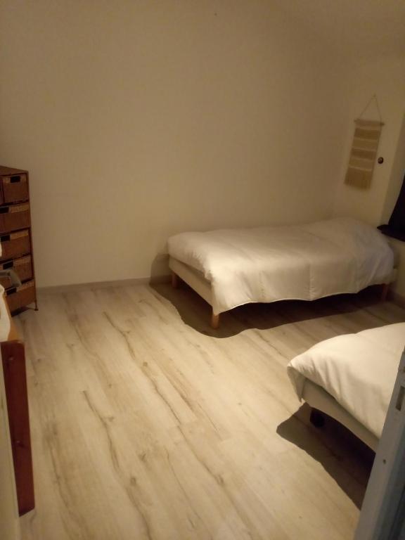 Posteľ alebo postele v izbe v ubytovaní Au p'tit bonheur