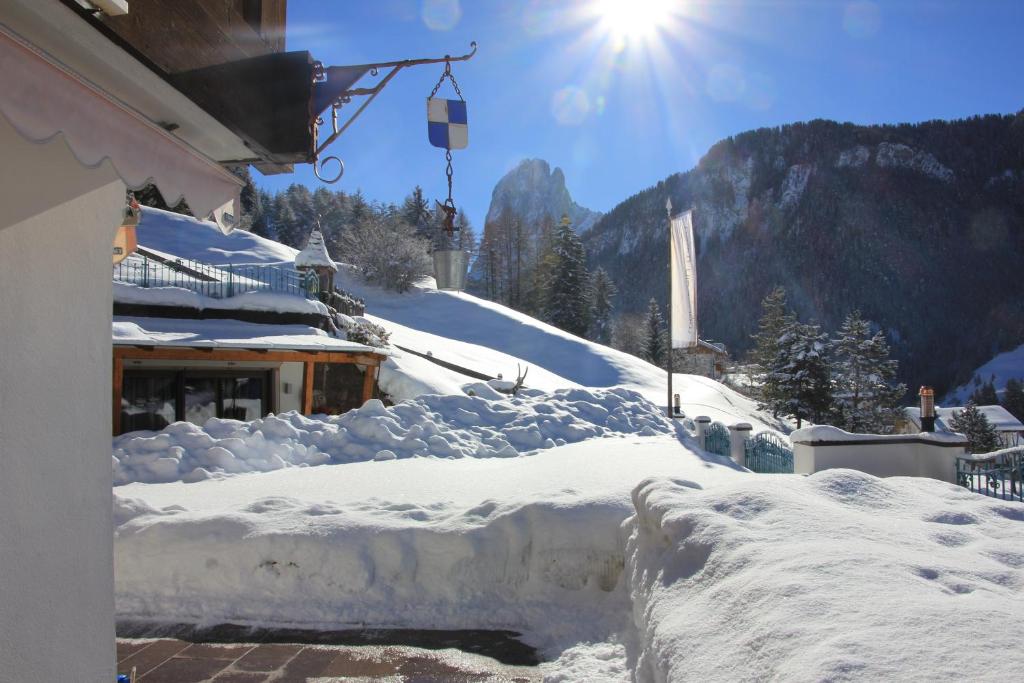 a pile of snow on the side of a building at Residence Prapoz in Ortisei