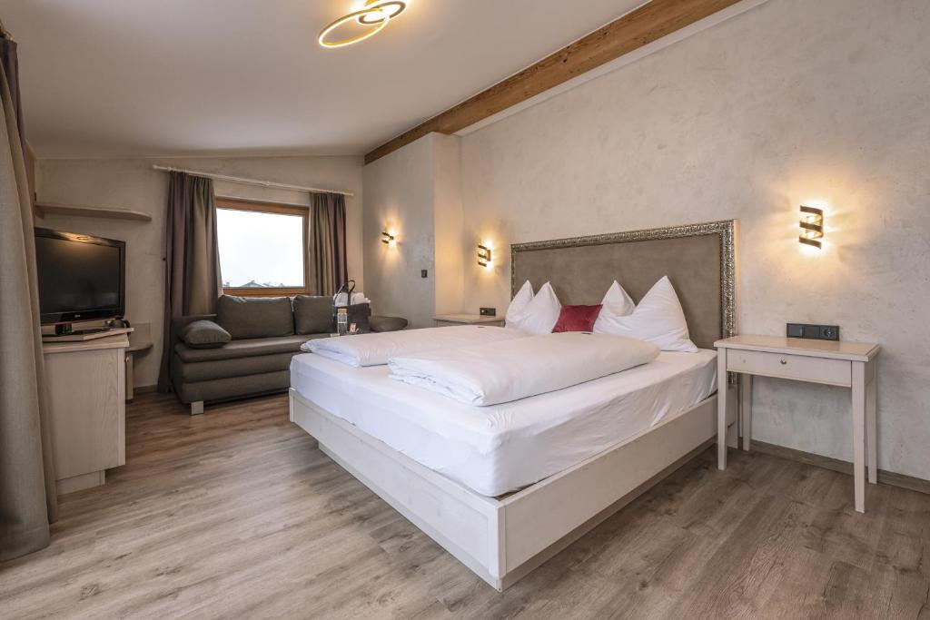 Postel nebo postele na pokoji v ubytování Hotel Acherl