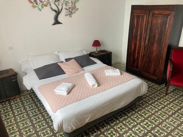 Postel nebo postele na pokoji v ubytování Hôtel La Demeure Coloniale