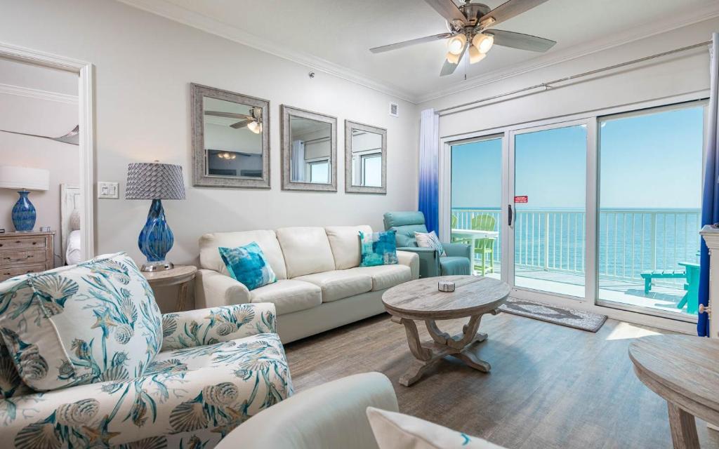 a living room with a couch and a table at Seawind 809 condo in Gulf Shores