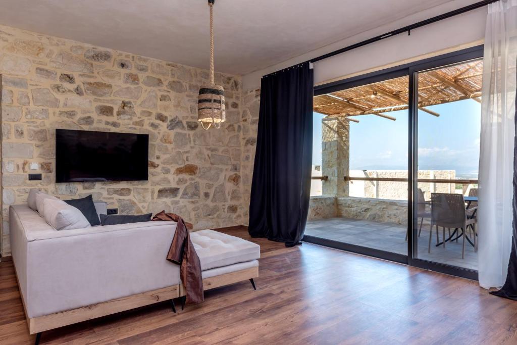 A television and/or entertainment centre at Alagni Cretan Resort