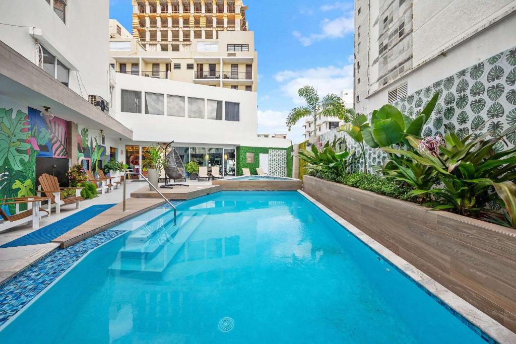 a swimming pool in the middle of a building at Abitta Boutique Hotel, Ascend Hotel Collection in San Juan