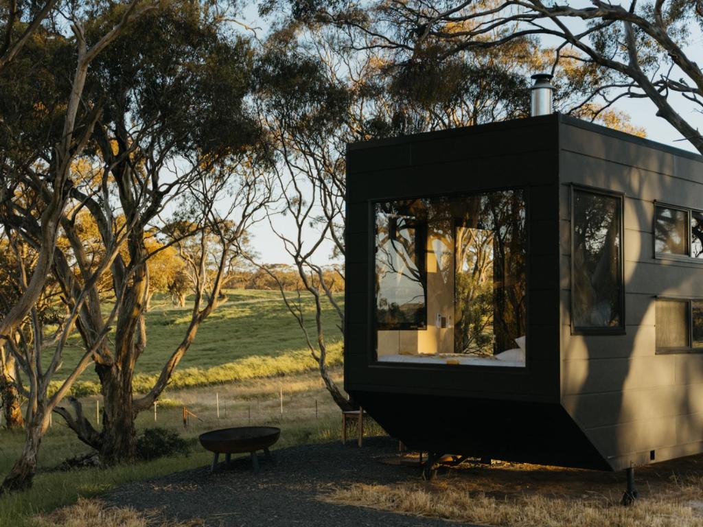 a black and white tiny house in a field at CABN Clare Valley in Mintaro