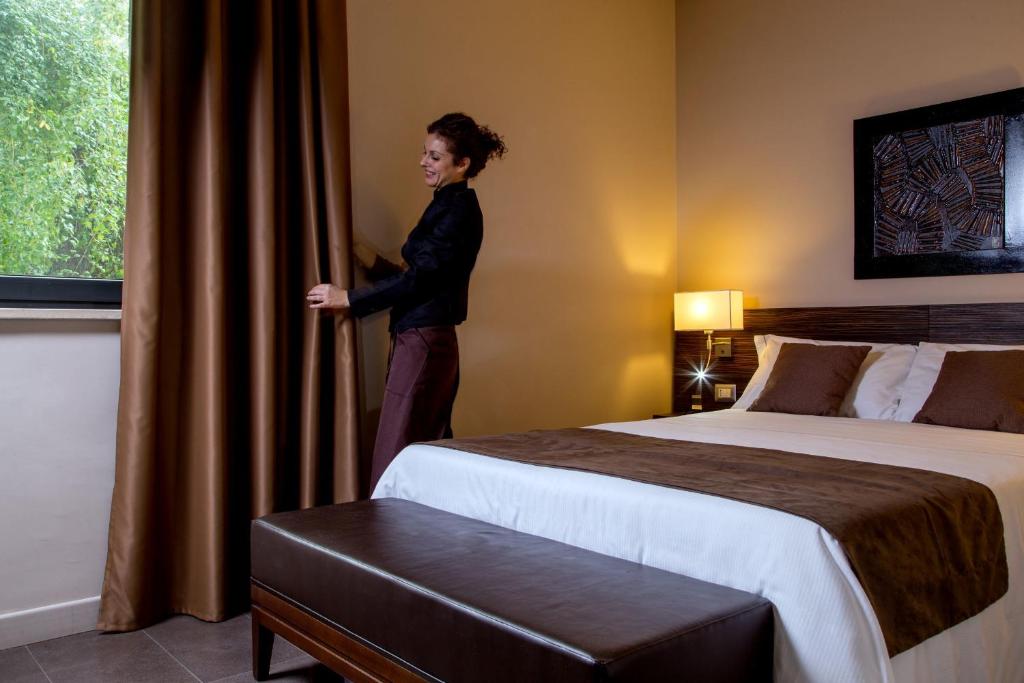 Postel nebo postele na pokoji v ubytování Park Hotel Sabina