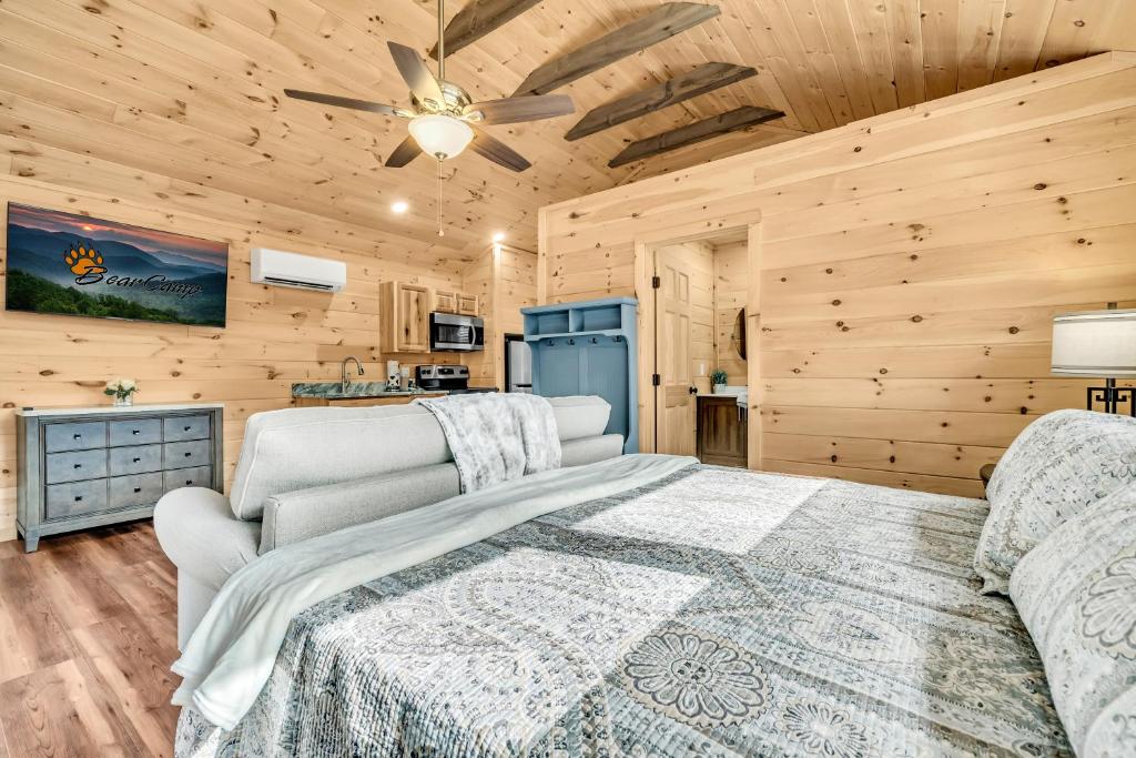 a bedroom with a large bed and a ceiling fan at The Bungalow At Greenbriar Creek -Pickleball Court, Creek, WIFI, Mountain Views, Starting at 79" in Cosby