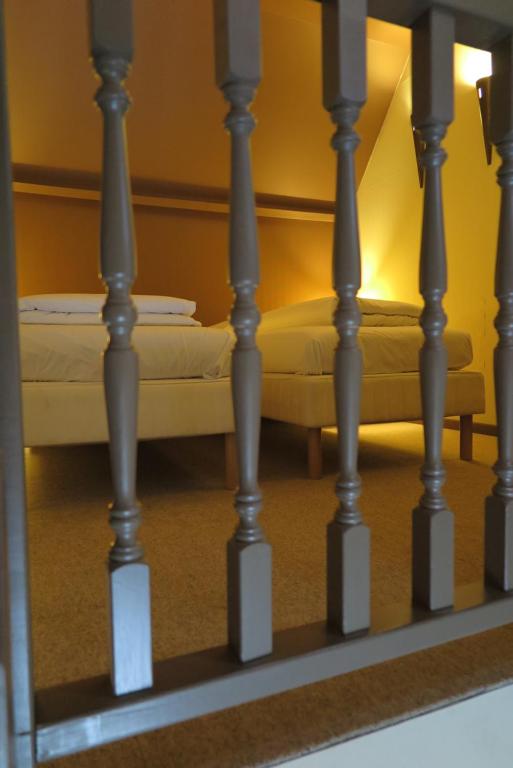 Postel nebo postele na pokoji v ubytování Hotel Malcot