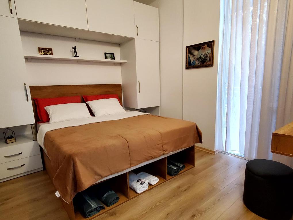 מיטה או מיטות בחדר ב-Roni Apartment