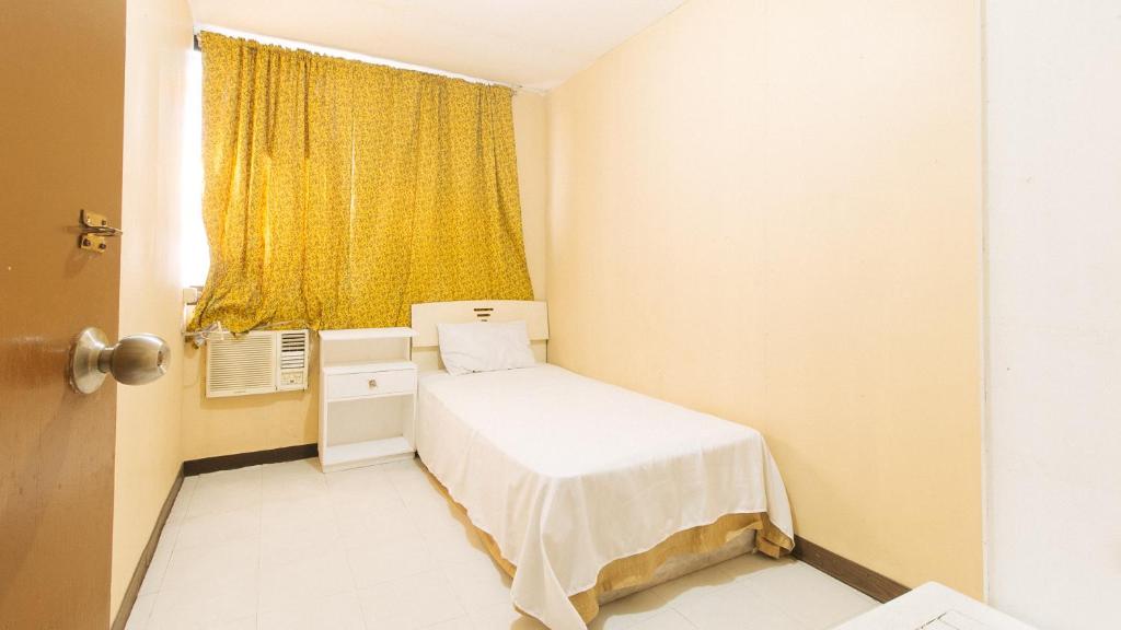 Ein Bett oder Betten in einem Zimmer der Unterkunft Waterfun Condominium Hostel