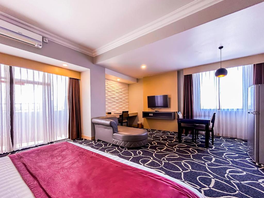 TV a/nebo společenská místnost v ubytování Planet Holiday Hotel & Residence