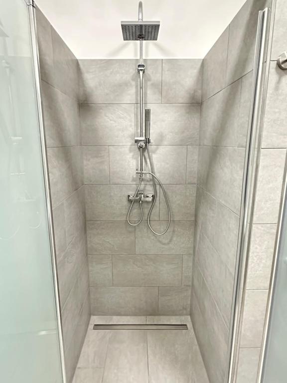 a shower with a glass door in a bathroom at EasyLiving Darmstadt in Darmstadt
