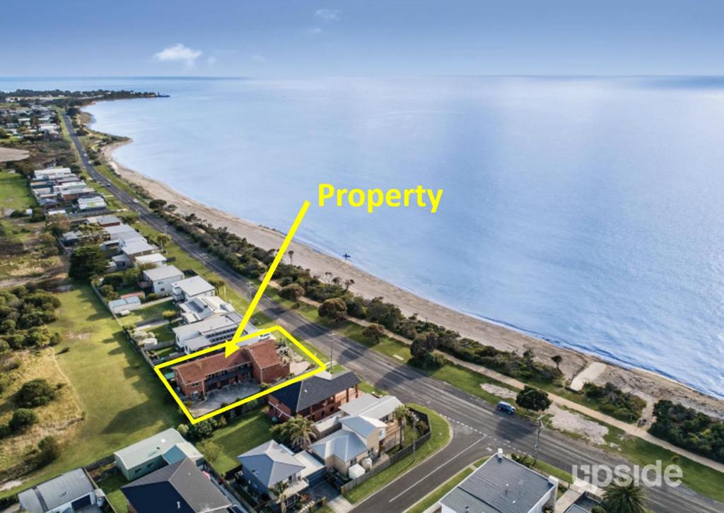 an aerial view of a beach with a yellow arrow labeling property at Beach Haven - Beach and Cafes on your doorstep - 3 bedrooms , Sleeps 6 in Saint Leonards