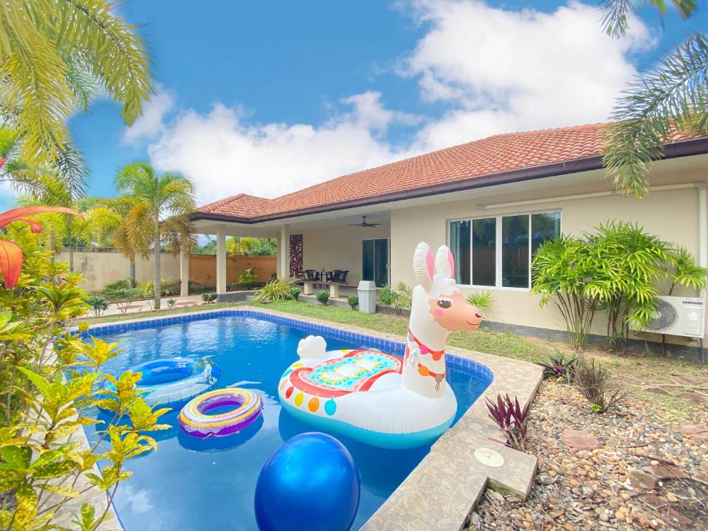 a pool with an inflatable bunny in a house at Sunny4 villa Pattaya in Ban Huai Yai