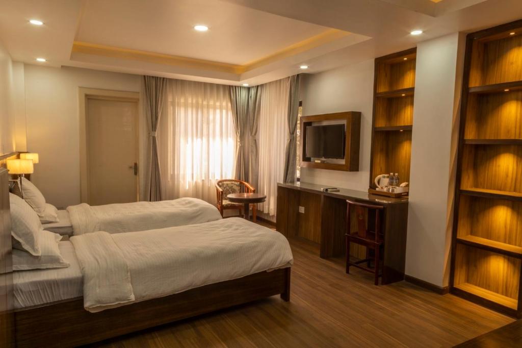 Postel nebo postele na pokoji v ubytování YULOKO GUEST HOUSE