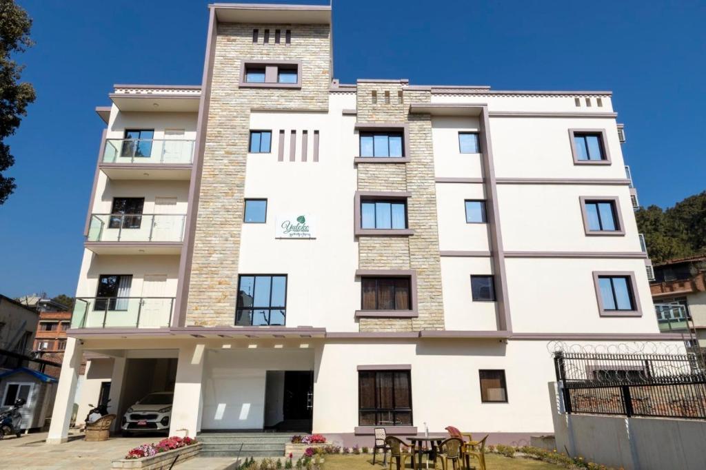 a building in front of a blue sky at YULOKO GUEST HOUSE in Kathmandu