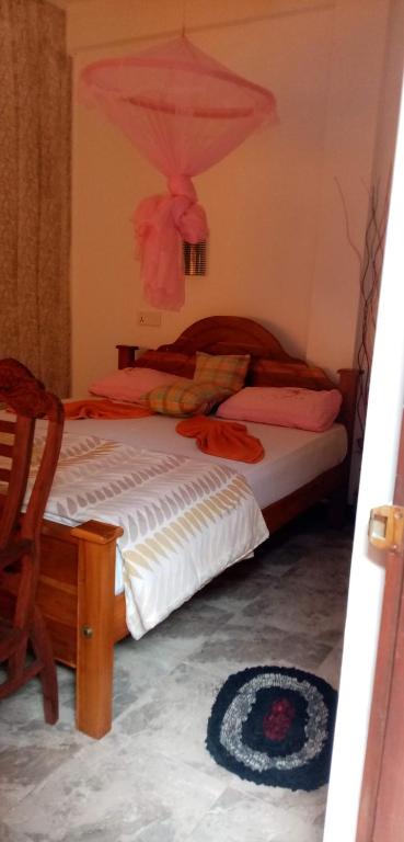 Postel nebo postele na pokoji v ubytování Nimsara Homestay