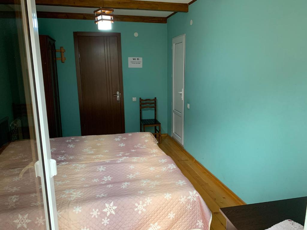 Postel nebo postele na pokoji v ubytování Zandarashvili Guest House