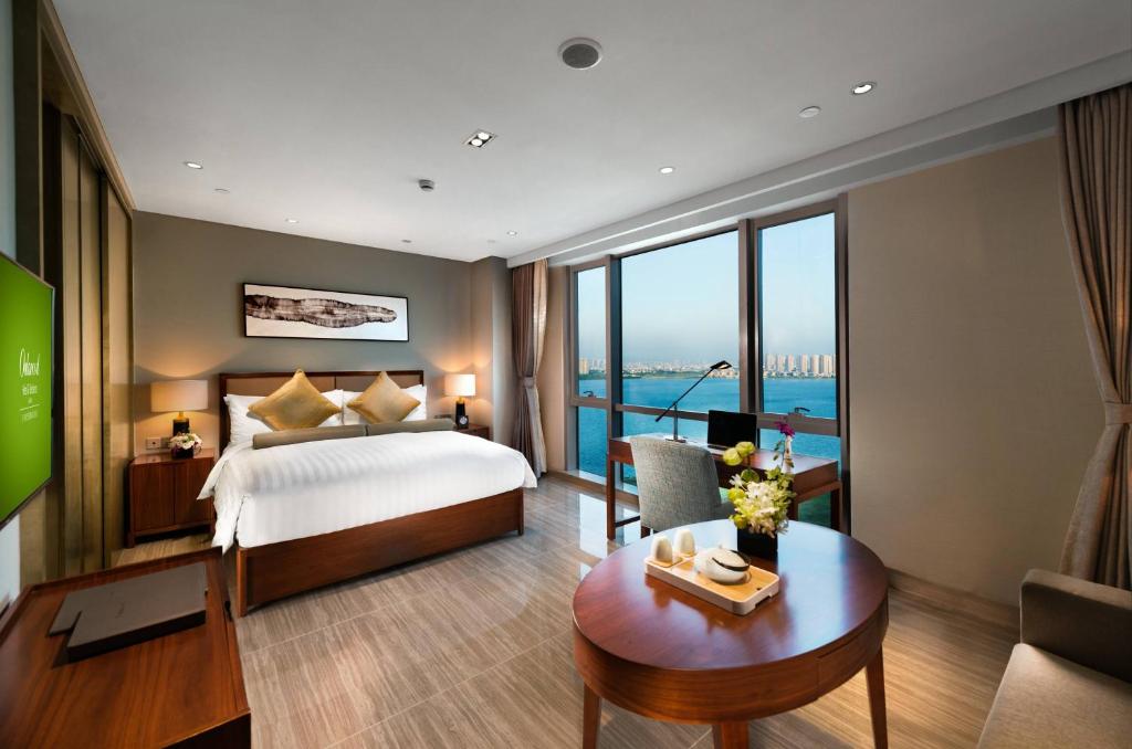 Postel nebo postele na pokoji v ubytování Oakwood Hotel & Residence Suzhou