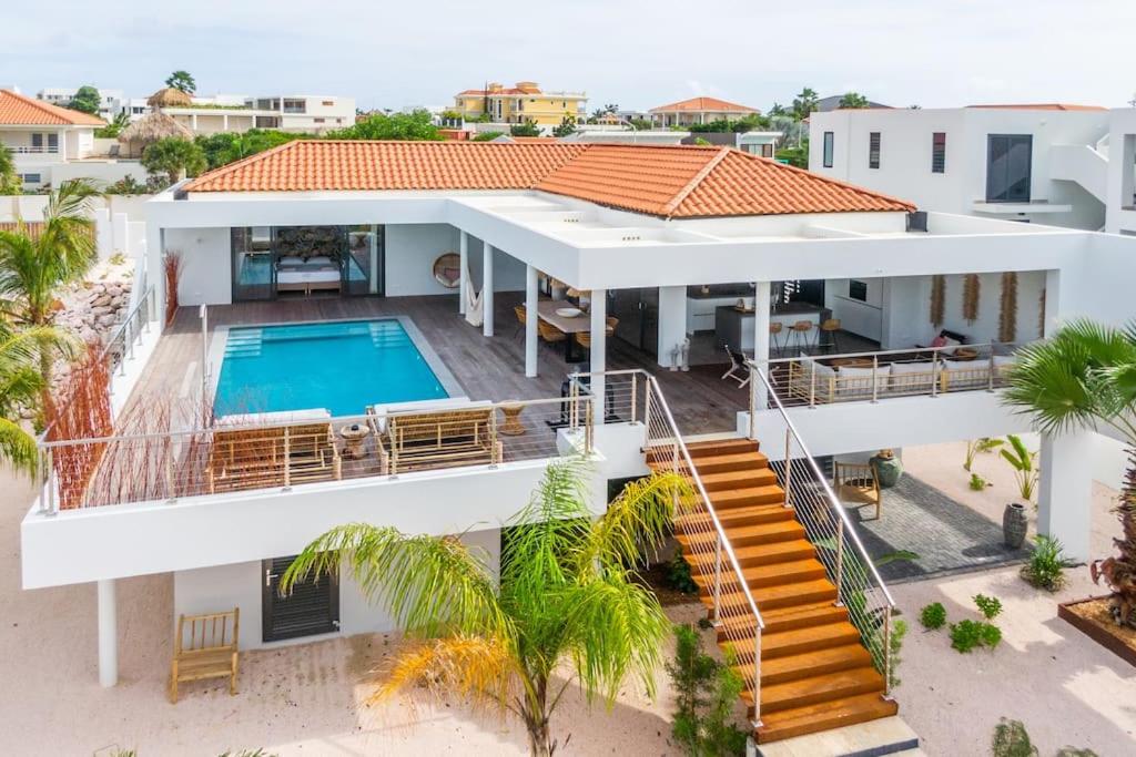 an aerial view of a house with a swimming pool at Villa Flamingo - LXRYHOME Collection in Jan Thiel