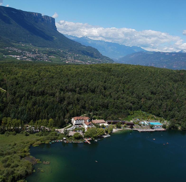 an aerial view of a resort on a lake at Seehotel Sparer in Appiano sulla Strada del Vino
