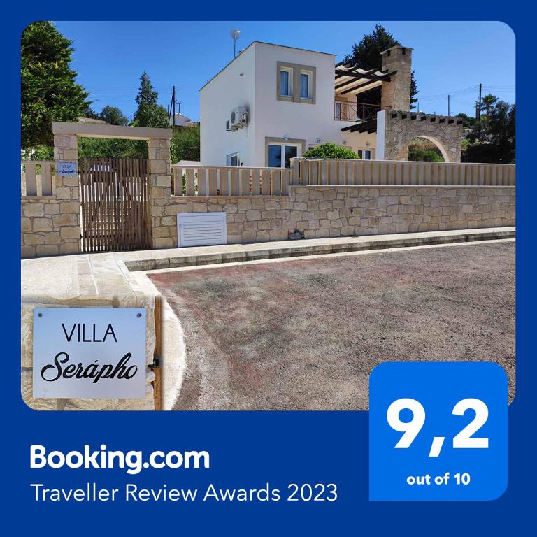 a house with a sign in front of it at VILLA SERAPHO in Paphos