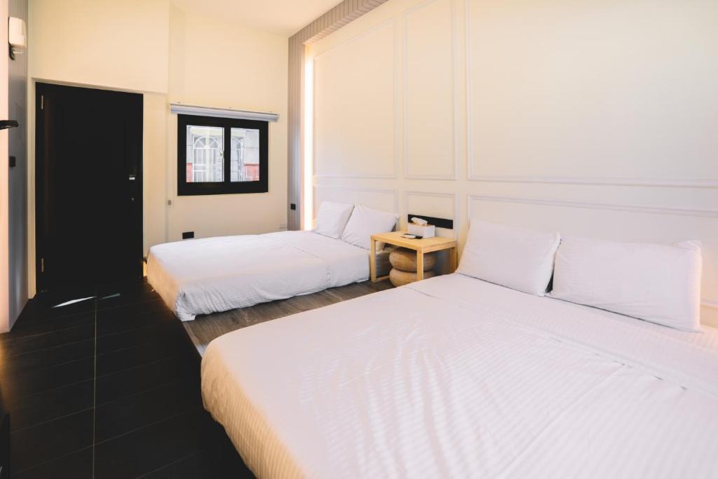 Postel nebo postele na pokoji v ubytování Xiaoliuqiu Ayana B&B