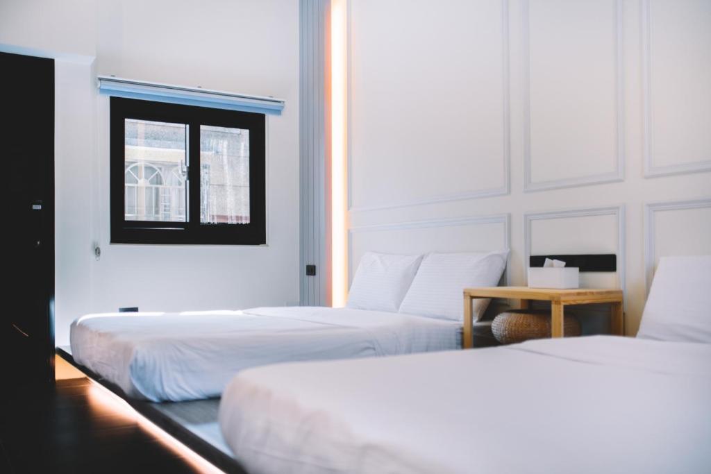 Postel nebo postele na pokoji v ubytování Xiaoliuqiu Ayana B&B