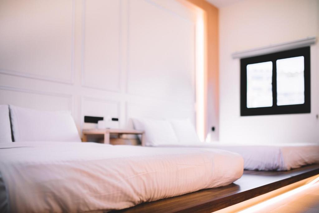 Postel nebo postele na pokoji v ubytování Xiaoliuqiu Ayana B&B