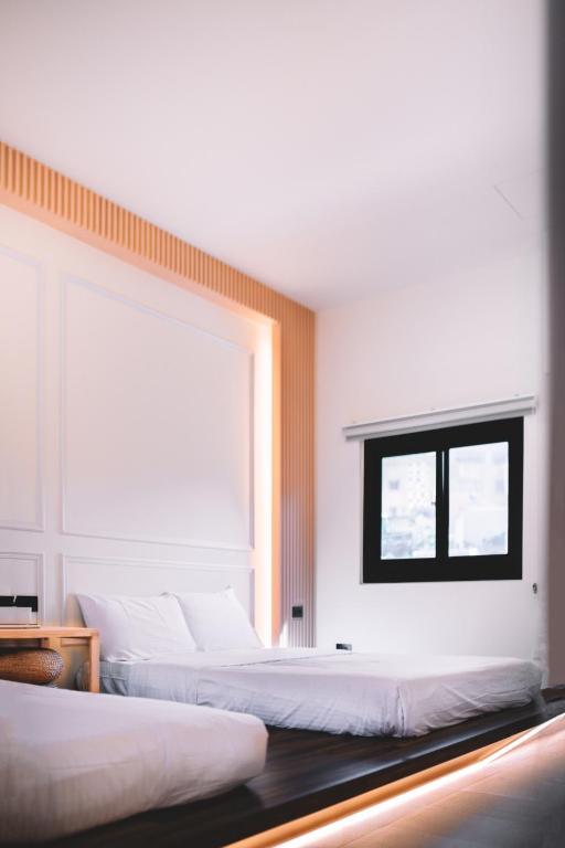 Postel nebo postele na pokoji v ubytování Xiaoliuqiu Ayana B&B