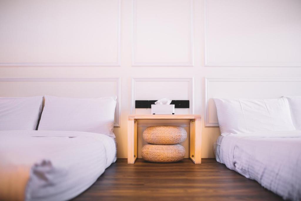 Postel nebo postele na pokoji v ubytování Xiaoliuqiu Ayana B&B