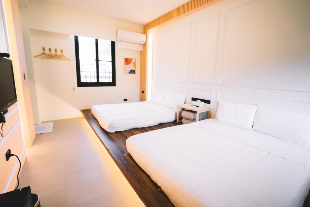 Postel nebo postele na pokoji v ubytování Xiaoliuqiu Ayana B&B