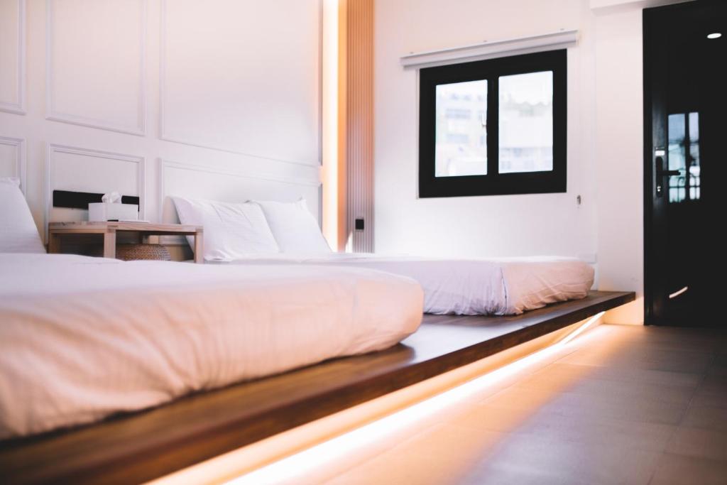 Postel nebo postele na pokoji v ubytování Xiaoliuqiu Ayana B&B