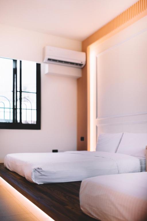 Postel nebo postele na pokoji v ubytování Xiaoliuqiu Ayana B&B