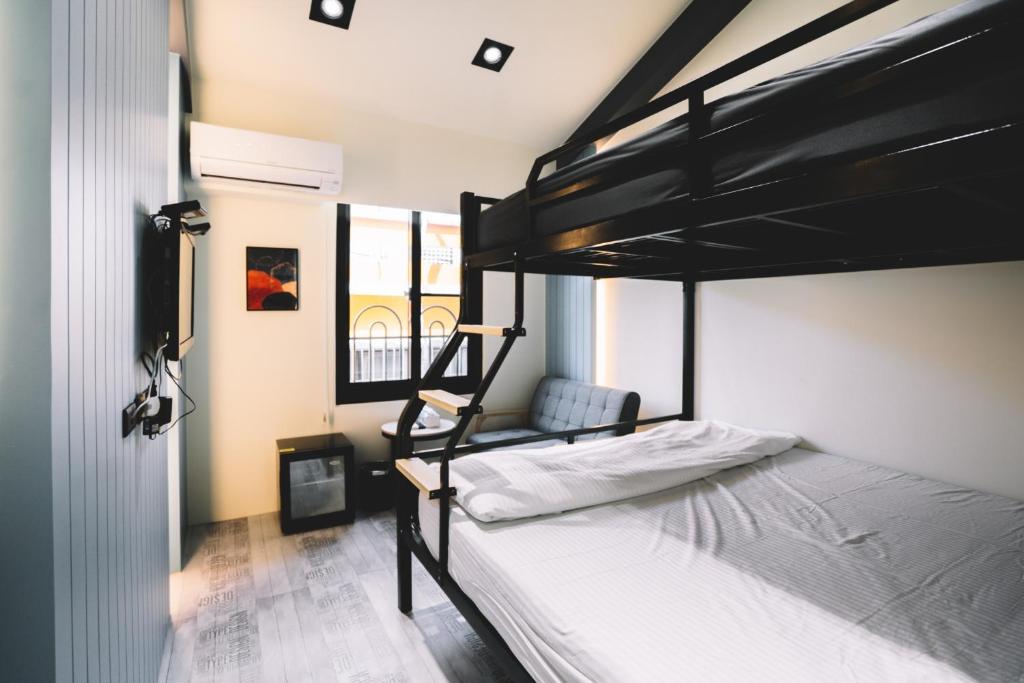 Postel nebo postele na pokoji v ubytování Xiaoliuqiu Ayana B&B